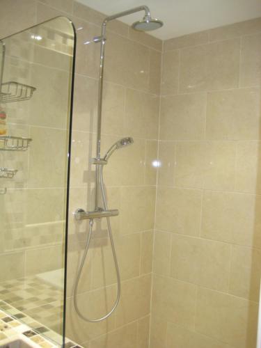 a shower with a glass door in a bathroom at Drumspittal House Guest Accomodation in Armagh