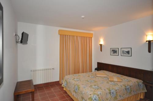 Un pat sau paturi într-o cameră la Casa do Preto