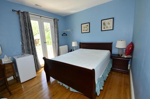 Ein Bett oder Betten in einem Zimmer der Unterkunft Ambassador B&B Guest Home