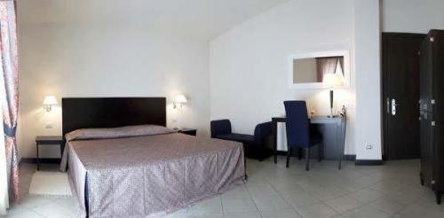 Postel nebo postele na pokoji v ubytování Hotel I' Fiorino
