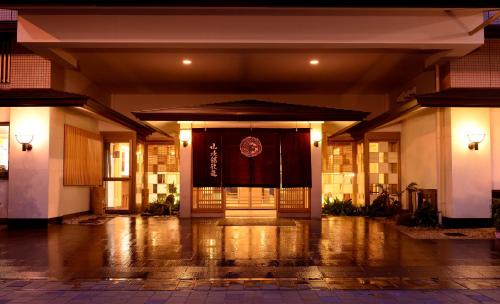 a front door of a building at night at Sansuikan Kinryu in Hamamatsu