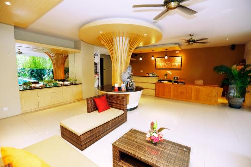 a living room with a couch and a table at Argya Santi Resort in Jimbaran