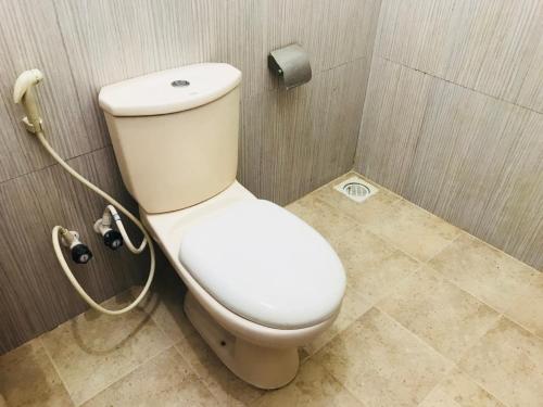 a bathroom with a toilet in a shower at Emarald Holiday Homes in Anuradhapura