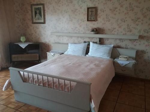 a bedroom with a large bed in a room at Maisonette Afroditi in Perea