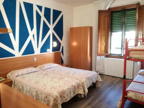 Postel nebo postele na pokoji v ubytování Hotel Prati