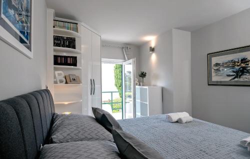 a living room with a bed and a sliding glass door at Villa Bandic in Baška Voda