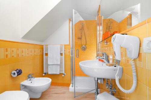 a bathroom with a sink and a toilet at Il Palmento Relais in Piano di Sorrento