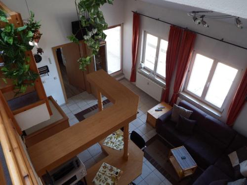 an overhead view of a living room with a staircase at Fewo Oase 28_GROT in Ostseebad Karlshagen