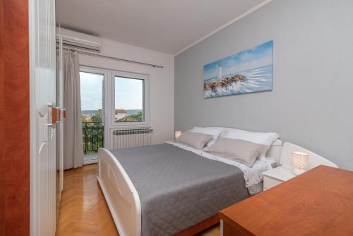 Postel nebo postele na pokoji v ubytování Marinella