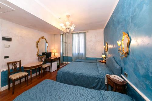 Postel nebo postele na pokoji v ubytování Hotel Pantalon