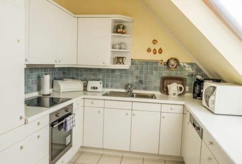 Nhà bếp/bếp nhỏ tại Ferienwohnung Ostfriesenglück