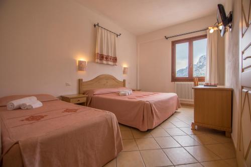 Postel nebo postele na pokoji v ubytování Gorropu Hotel