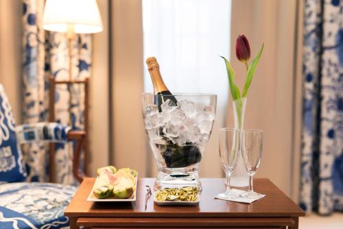 a table topped with a vase filled with flowers at ProfilHotels Riddargatan in Stockholm