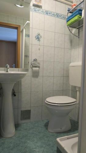 a bathroom with a toilet and a sink at D-D in Bovec