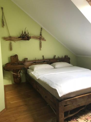 a bedroom with a bed and a wooden table at Complex Vivcharyk in Skole