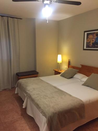 a bedroom with a large bed in a room at Hotel Florido in Sort