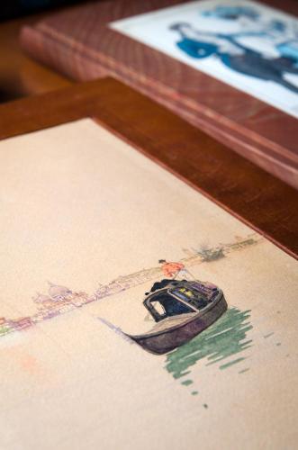 a picture of a painting of a shoe on a table at Hotel Palazzo Giovanelli e Gran Canal in Venice