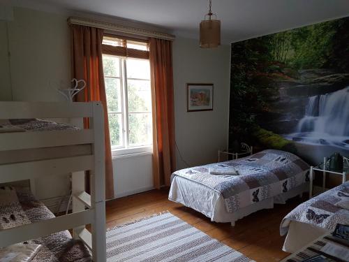 Postel nebo postele na pokoji v ubytování Nya Strandgårdens Wärdshus