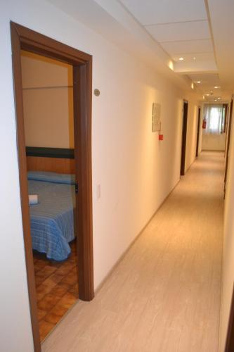 Postel nebo postele na pokoji v ubytování Hotel Smeraldo