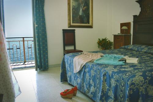 Letto o letti in una camera di Hotel La Riva