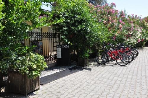 a group of bikes parked in front of a building at Mr. Dim Exclusive Apart Hotel in Göcek