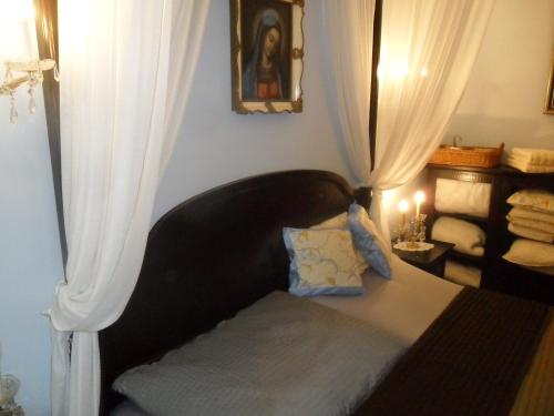 a bed in a room with a curtain at Luxury near Castle in Vienna
