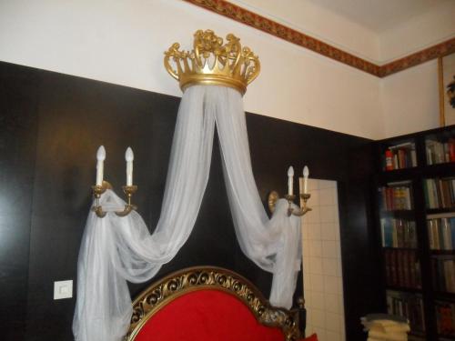 a bed with a crown on top of it at Luxury near Castle in Vienna
