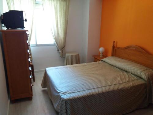 Postel nebo postele na pokoji v ubytování Acogedor Apartamento 2ª línea playa