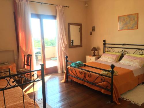 Un ou plusieurs lits dans un hébergement de l'établissement Guest house Villa di Judighes