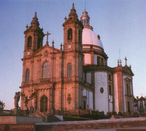 a large building with a clock tower on top of it at Hotel Dona Sofia in Braga