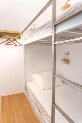 a small room with bunk beds in it at May Rooms Taipei Main Station in Taipei