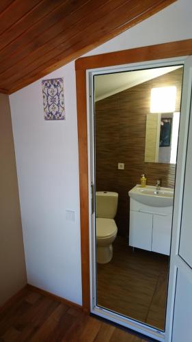 a bathroom with a toilet and a sink at Guest House Dacha in Karolino-Buhaz