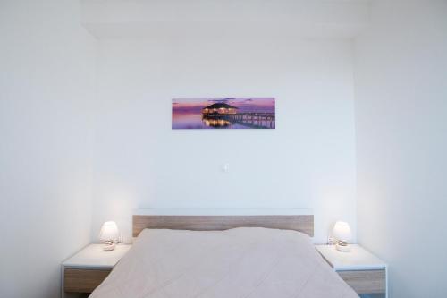 Ένα ή περισσότερα κρεβάτια σε δωμάτιο στο Blue Horizon Apartments