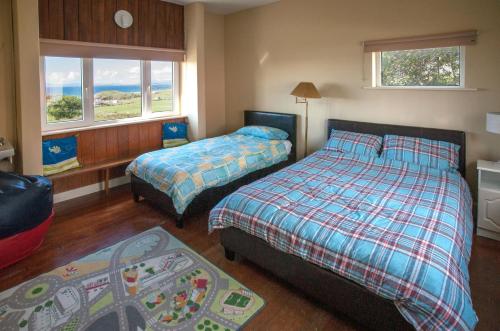 מיטה או מיטות בחדר ב-Cottage 202 - Renvyle