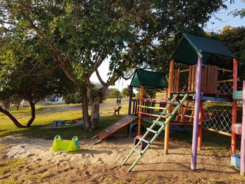 a playground with a slide in a park at Serenity Nhabanga, Bilene in Nhabanga