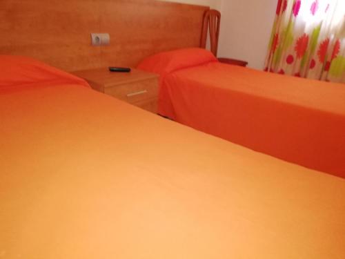 Ένα ή περισσότερα κρεβάτια σε δωμάτιο στο Hostal Santa Clara