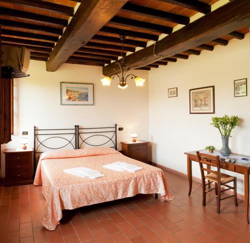 מיטה או מיטות בחדר ב-Agriturismo Casolare Lucchese