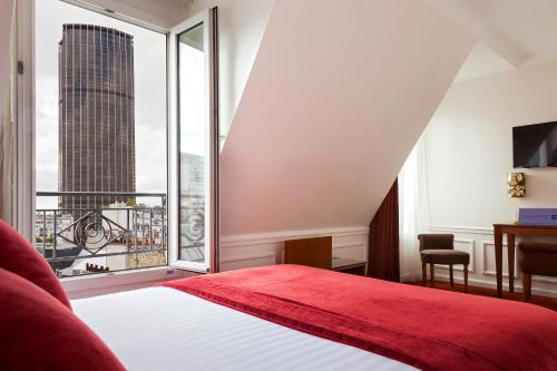 a bedroom with a red bed and a large window at Timhotel Tour Montparnasse in Paris