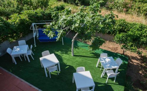 an overhead view of tables and chairs and a tree at Villa Saturno in Tropea
