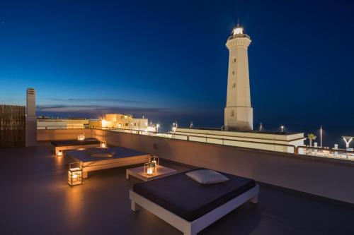 a lighthouse on the roof of a building at Casa del Faro in Torre Canne