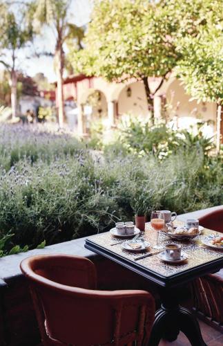 a table with food and drinks on top at Casa de Sierra Nevada, A Belmond Hotel, San Miguel de Allende in San Miguel de Allende