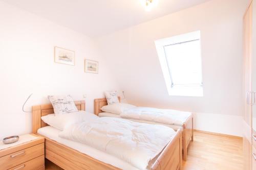 Postel nebo postele na pokoji v ubytování Ferienwohnung Mittendrin