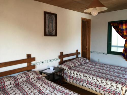 Кровать или кровати в номере Posada Santa María
