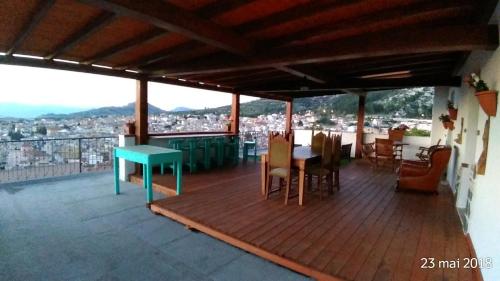 a deck with a table and chairs on a balcony at B&B Bella Vista in Dorgali