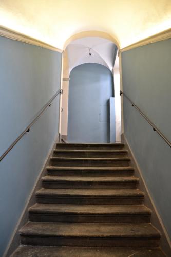 a staircase in an empty building with a stair case at Tuscany Experience BnB in Foiano della Chiana