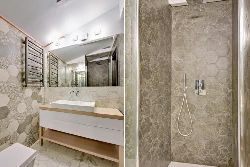 a bathroom with a sink and a shower at Sopot Comfort Apartments Superior in Sopot