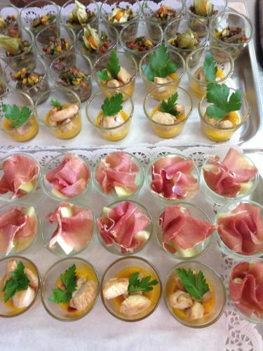 a table topped with bowls of food on a table at Hotel Winter in Schöppingen