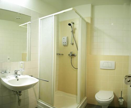 Ванная комната в Hotel Maxim