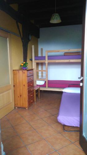 a room with two bunk beds and a dresser at Otardi in Asteasu