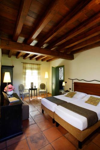 Una cama o camas en una habitación de Hotel Fossa Mala